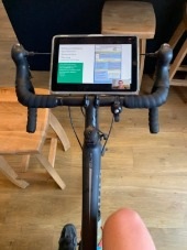 Prof Fraser attending a virtual conference whilst on a turbo trainer